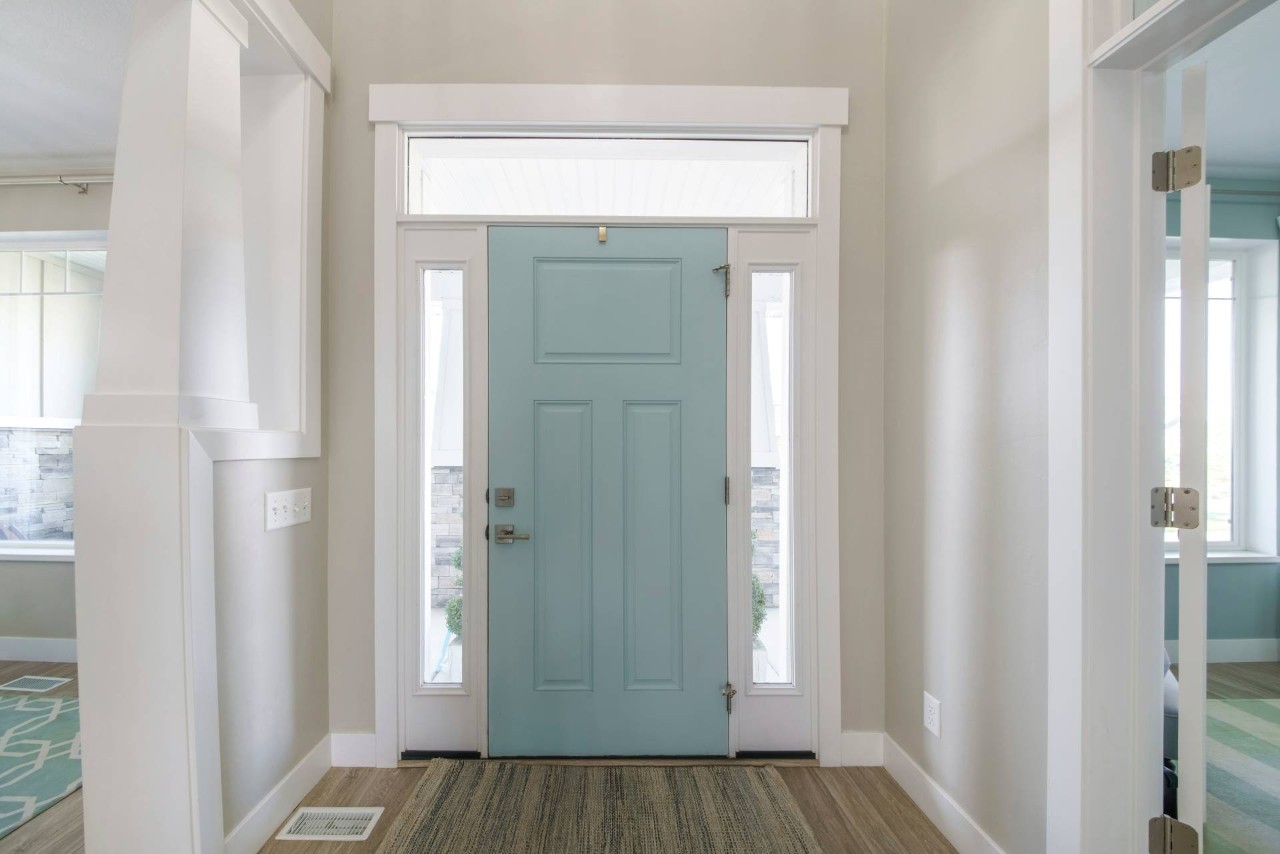Mint-colored front door with two white skylights at a home's airy entryway at Danville Interior Design Gallery near Danville, California (CA)