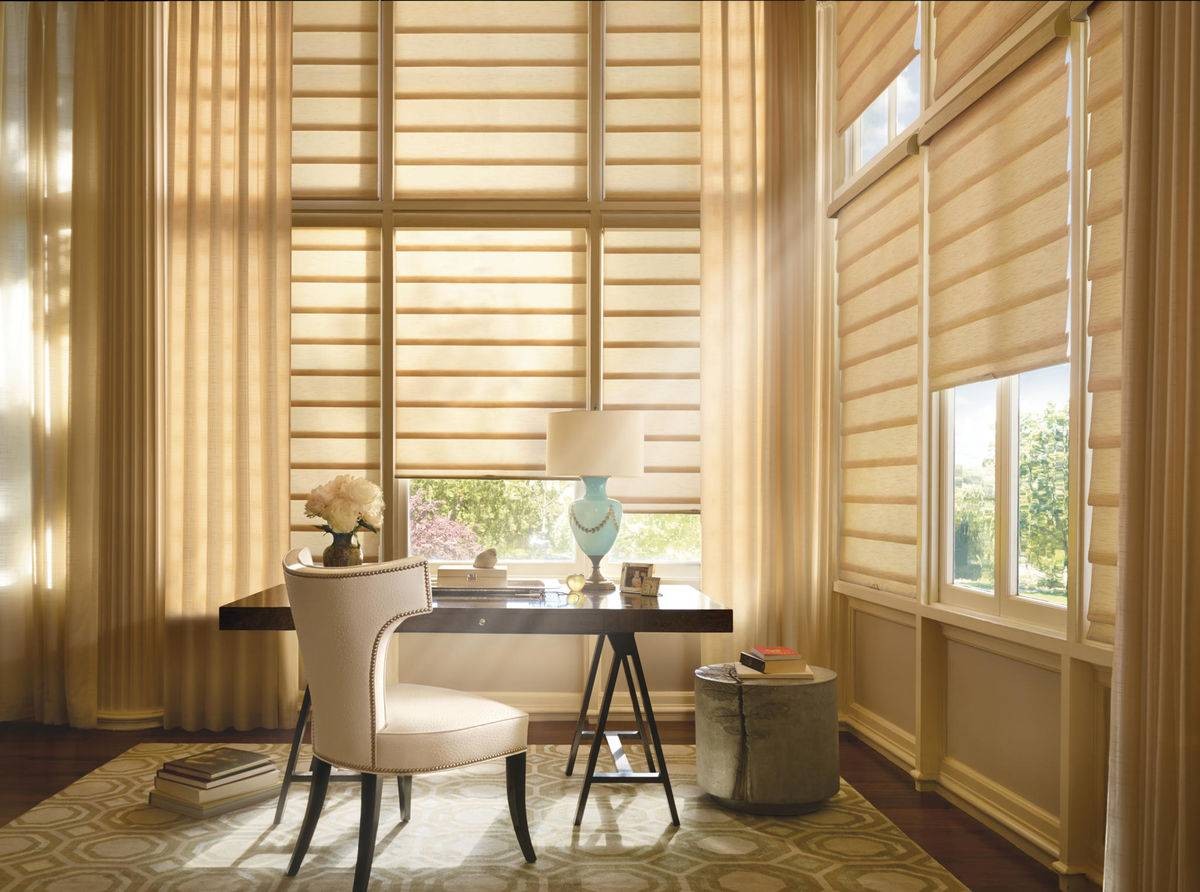 Hunter Douglas Vignette® Roman Shades covering the windows of a bright home office near Danville, CA